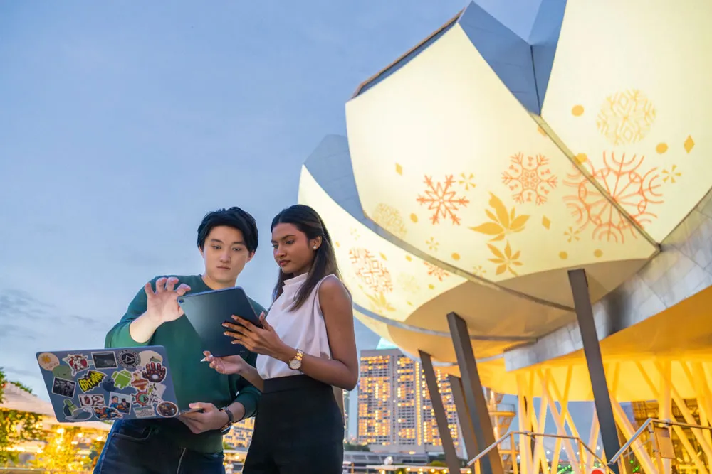 A man and a woman, using a tablet